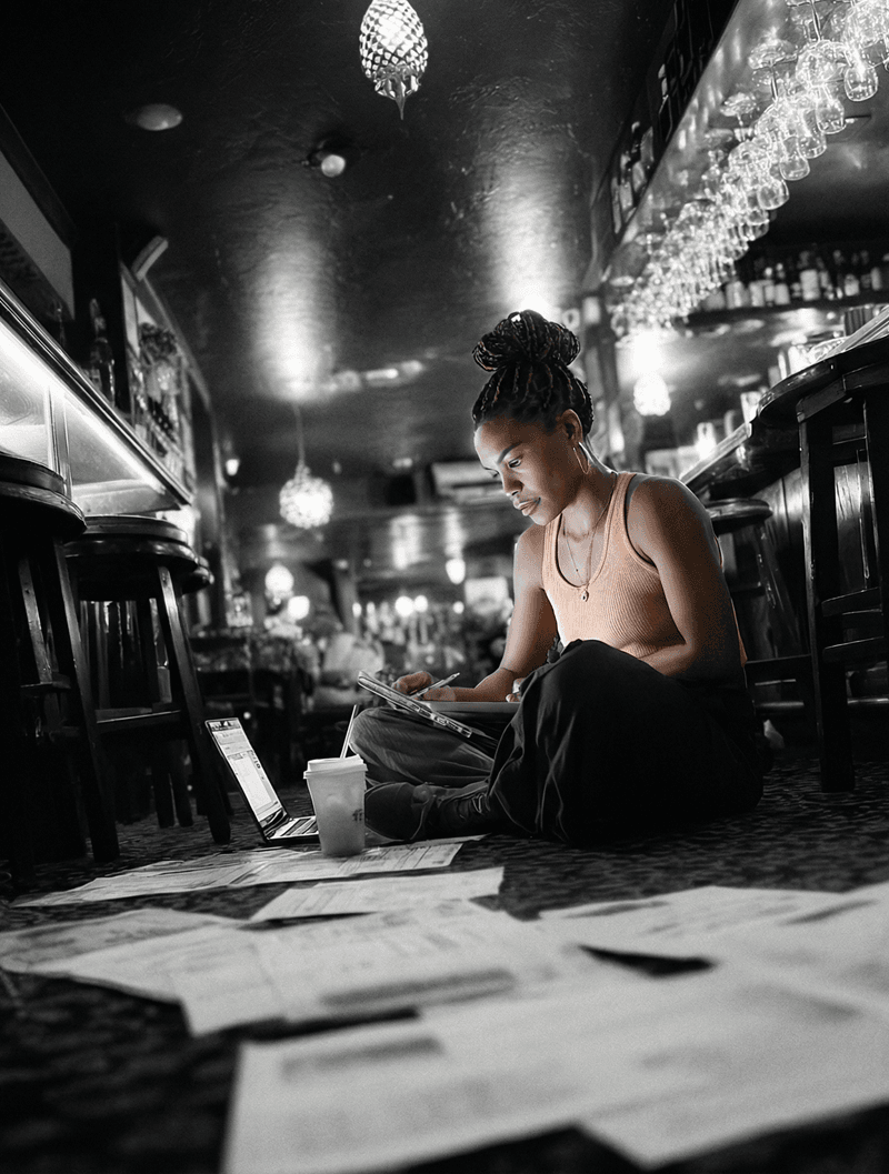Independent restaurant owner behind the counter